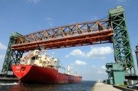Fednav\'s \"Federal Hunter\" passing under the Burlington Canal Lift Bridge. The Canal was established in 1826 and this bridge was built in 1962, and was built to carry a roadway and railway across it. The road has since been widened to four lanes.