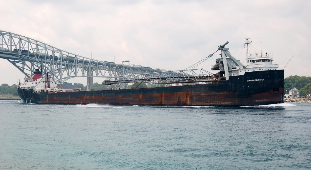 Canadian Transfer of the then Upper Lakes Shipping company sails up bound under the bluewater bridge at Sarnia. With the sale of the Upper Lakes fleet to Algoma shots like this are no longer possible. Today the "transfer" sails as Algoma Transfer.