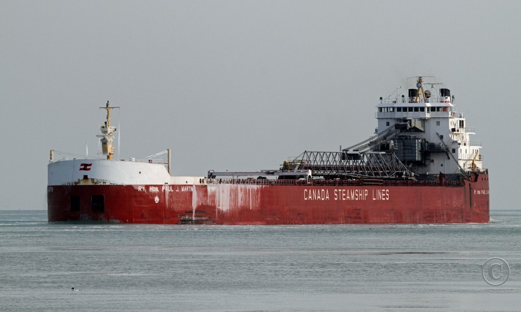 Late in the season sees the Rt. Hon. Paul J. Martin downbound on the Detroit River at Windsor. The vessel is named for the father of a former Canadian Prime Minister.

She was built at the Collingwood Shipyards in 1973 and named the H.M. Griffith. In 2000, the ship was rebuilt at Port Weller using the stern section of the Griffith while a new bow and cargo section were added. She was renamed the Rt. Hon. Paul J. Martin.