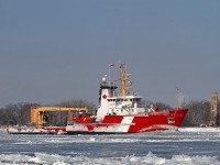 The CCGS Samuel Risley, upbound on the Detroit River in heavy ice, leads a convoy of ships (Saginaw, Algomarine, CSL Tadoussac) to lower Lake Huron.